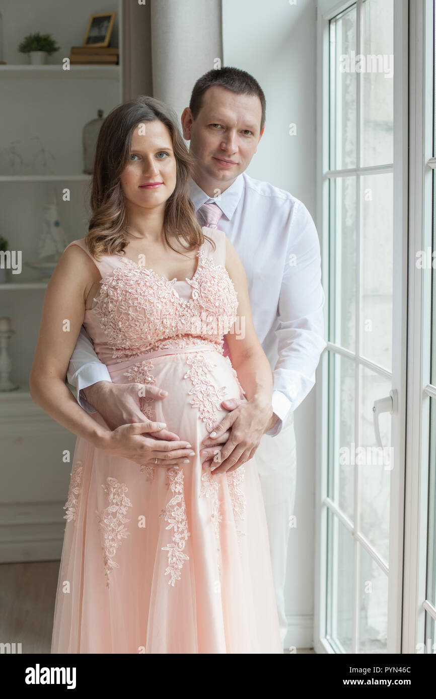 Loving Man Embracing Pregnant Woman Pregnant Couple Pregnancy Maternity Preparation And Expectation Concept Stock Photo Alamy