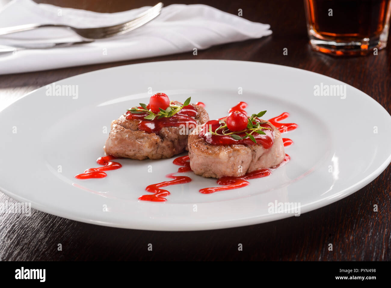 Veal medallions with cranberry sauce Stock Photo Alamy