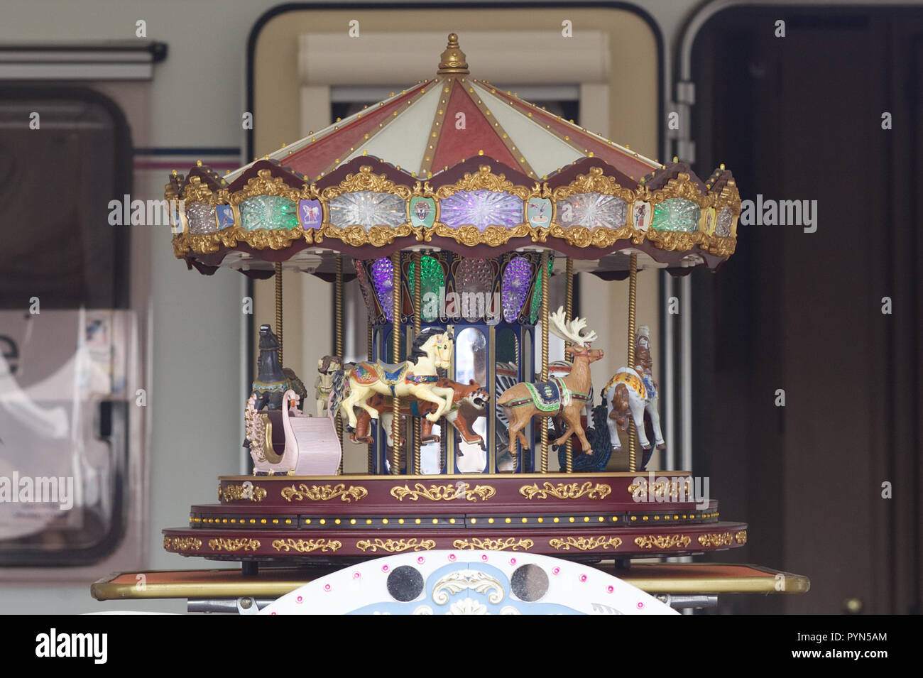 Miniature galloping horse carousel Stock Photo - Alamy