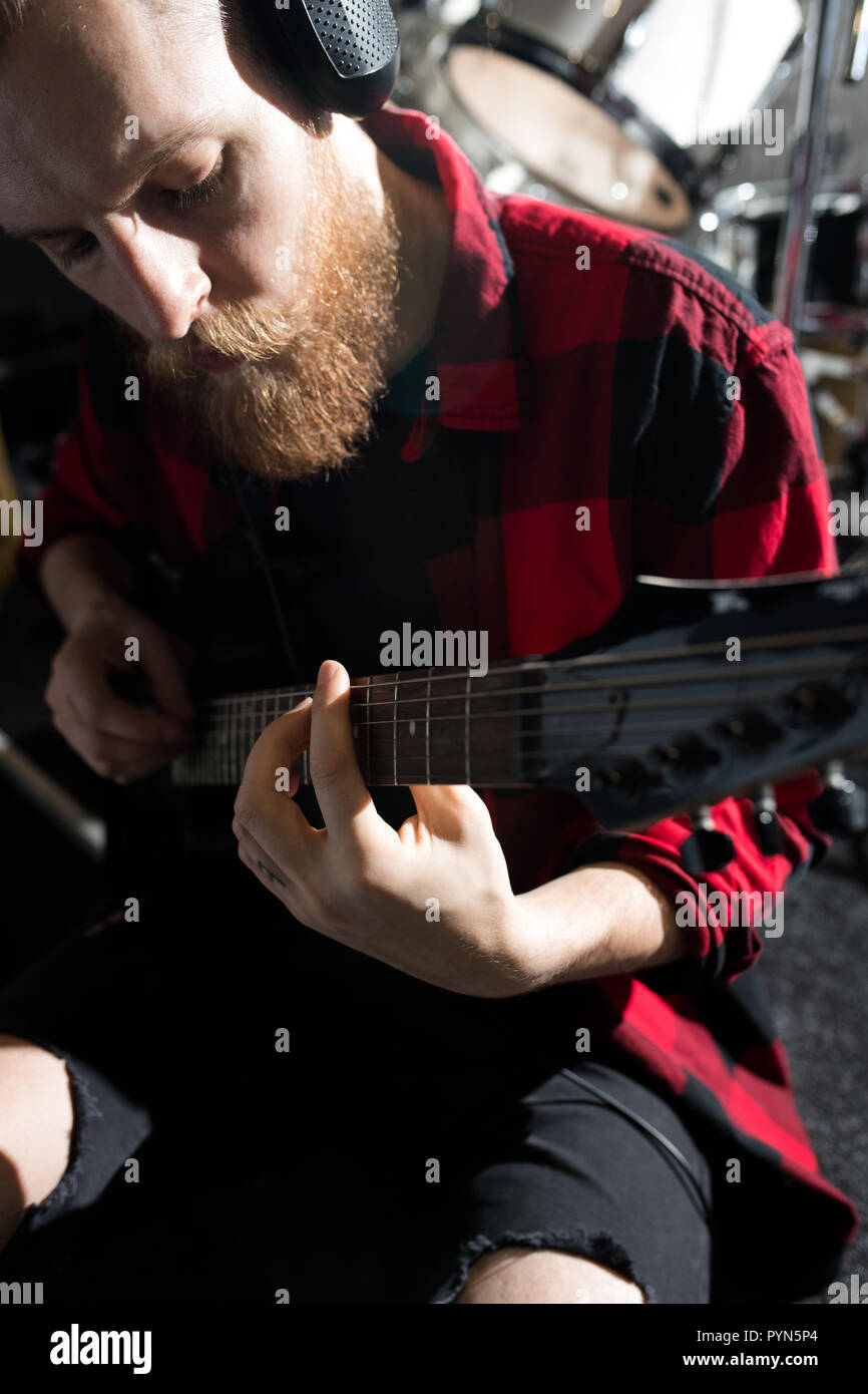 Bearded Man Playing Guitar Stock Photo