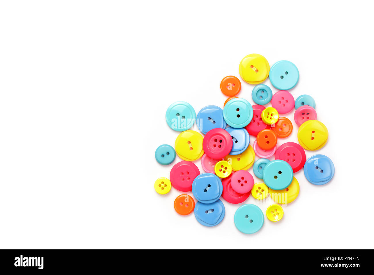 Colorful buttons stacked together on a white background Stock Photo