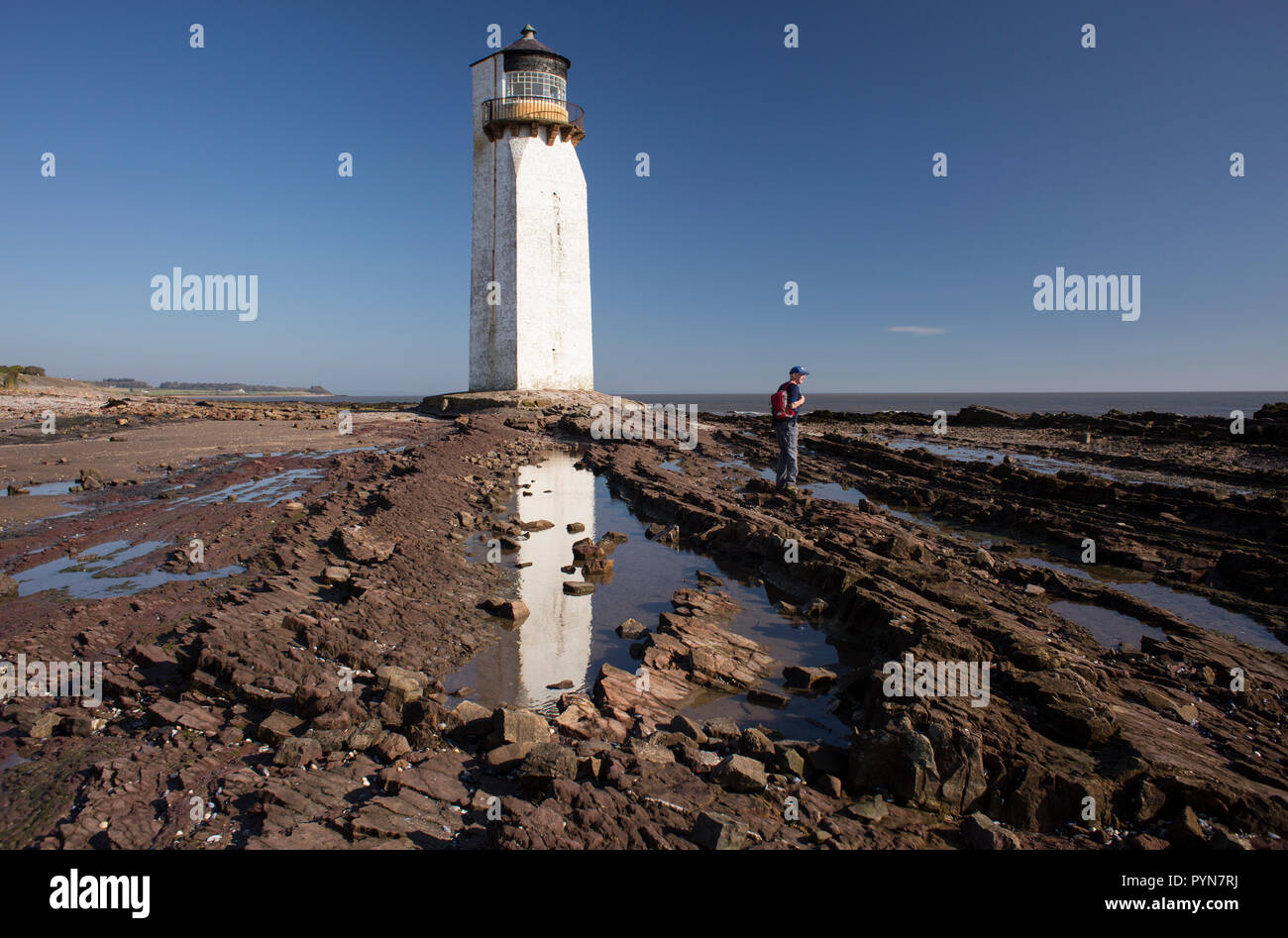 Southerness Lighthouse on the shore of the Solway Firth at Southerness. Southerness is one of the oldest lighthouses in Scotland Stock Photo