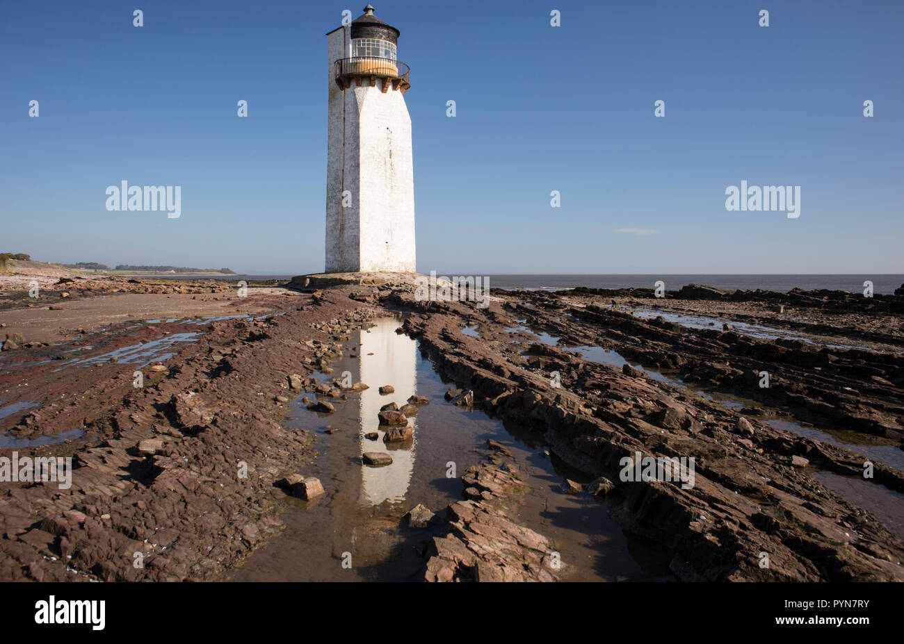 Southerness Lighthouse on the shore of the Solway Firth at Southerness. Southerness is one of the oldest lighthouses in Scotland Stock Photo