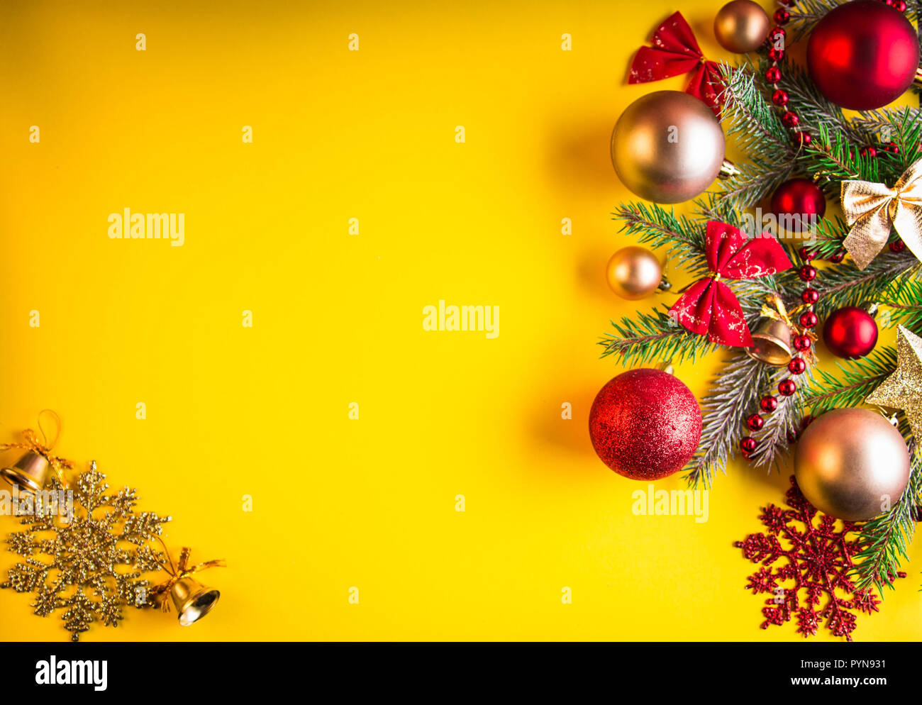 Yellow Christmas background with fir tree, toys and bows Stock ...