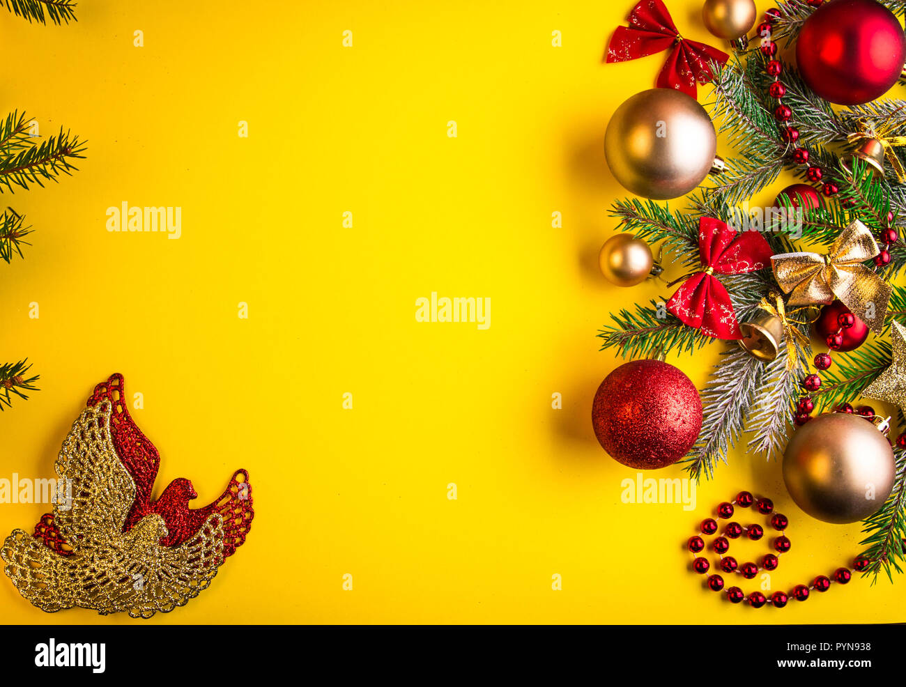 Yellow Christmas background with fir tree, toys and bows Stock ...