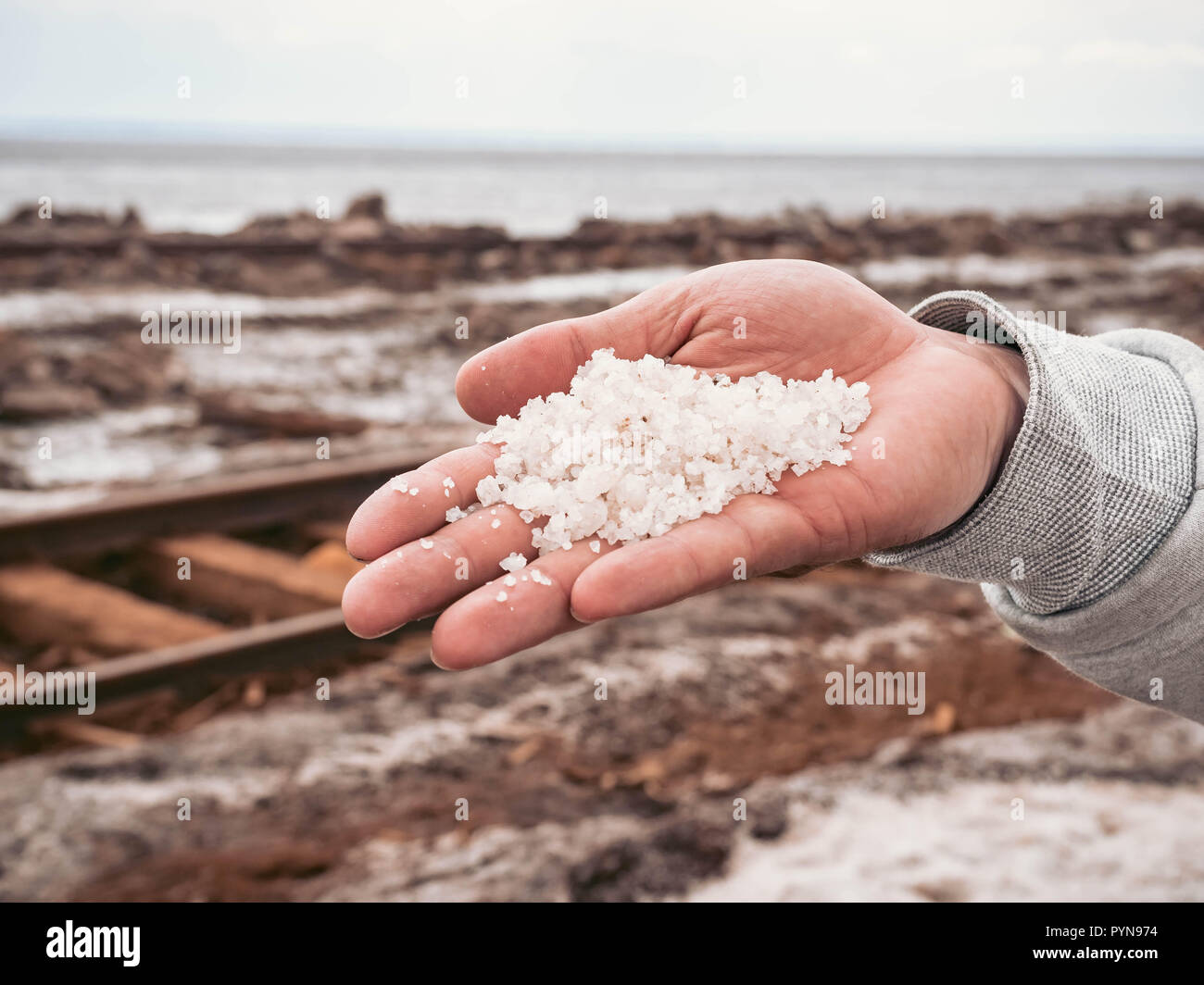 salt extraction old rusty railroad tracks on gravel embankment at salt