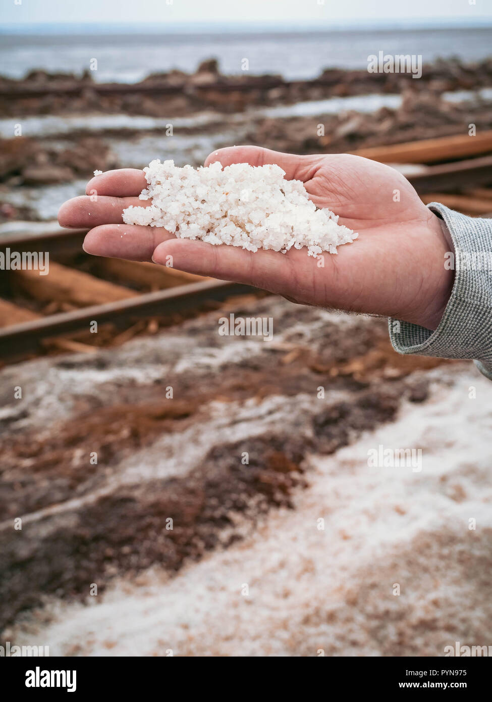 salt extraction old rusty railroad tracks on gravel embankment at salt