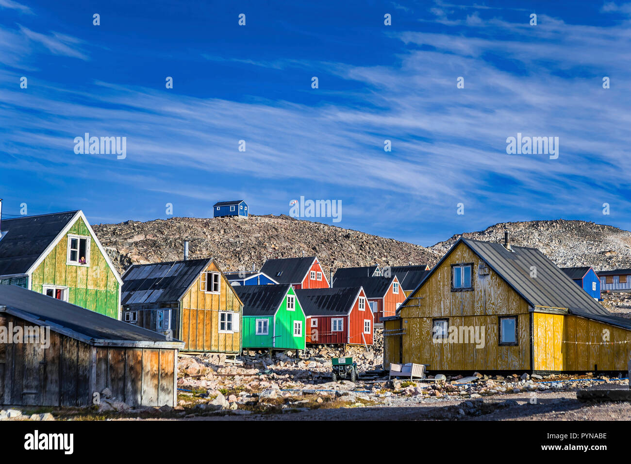 Colourful houses at Inuit village Ittoqqortoormiit, region Scoresbysunde, Greenland, North polar ocean, Arctic Stock Photo