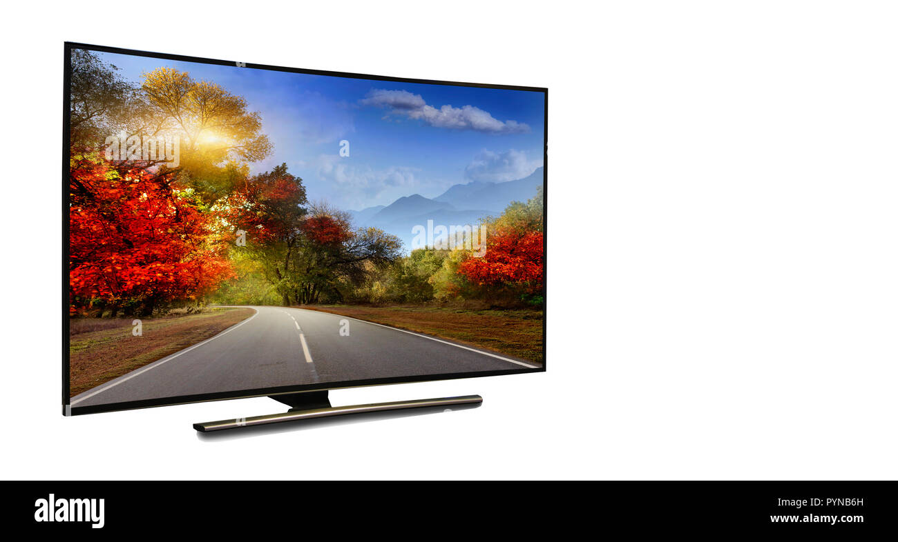 4k monitor isolated on white.  The road is rural, unpaved in the steppes at sunset. Modern, elegant TV 4 K, with incredibly beautiful colors of the im Stock Photo