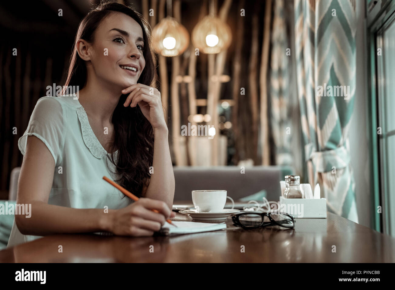 Dreamy female person thinking about her business Stock Photo