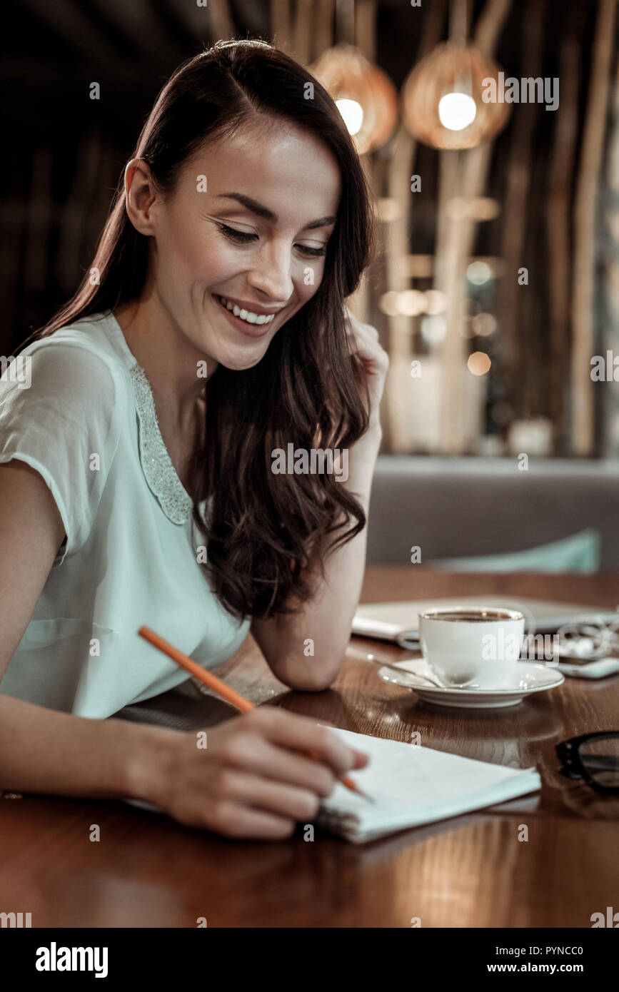 Shy brunette female person making important notices Stock Photo