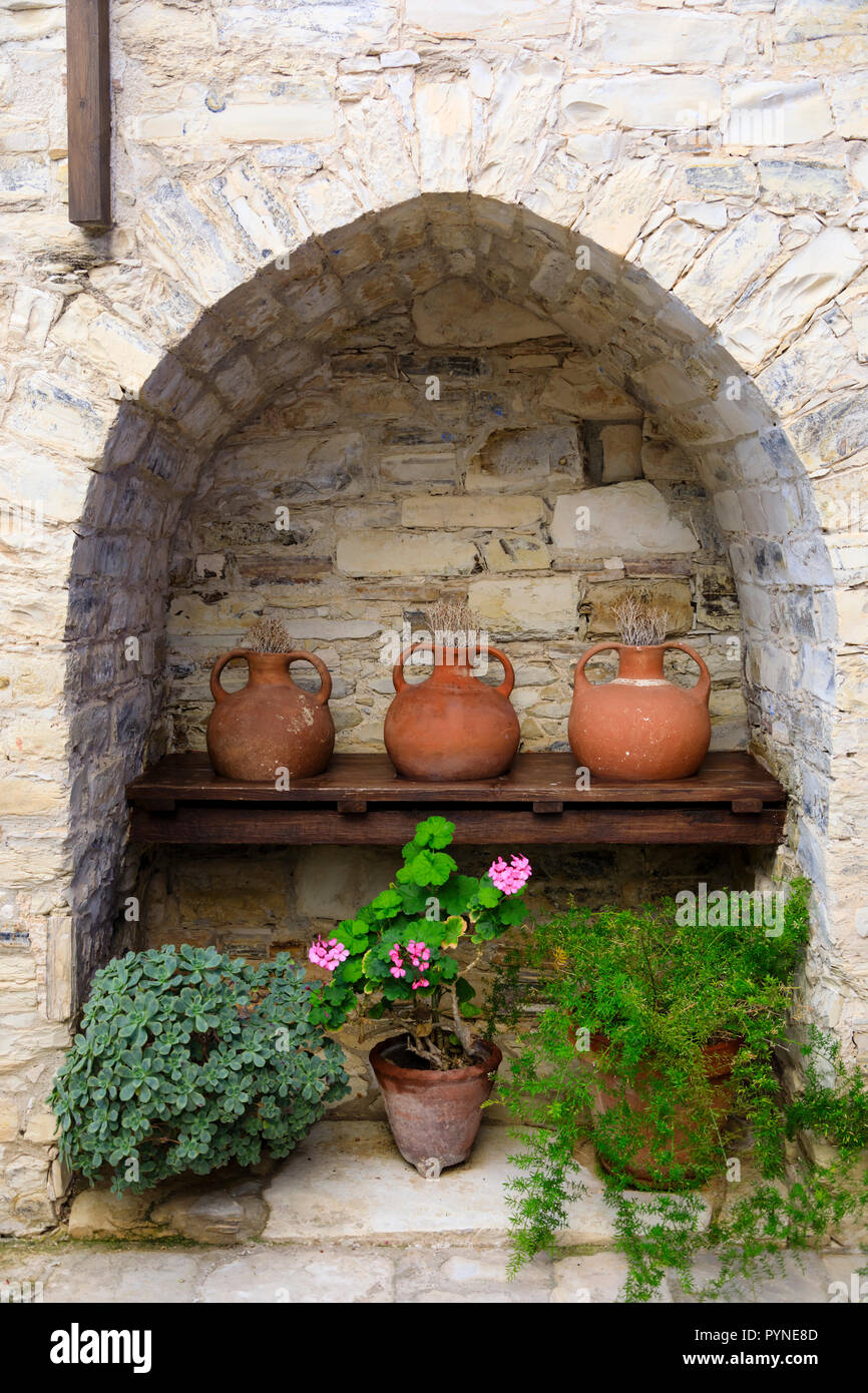 Old jars in an alcove, Pano Lefkara, Cyprus October 2018 Stock Photo