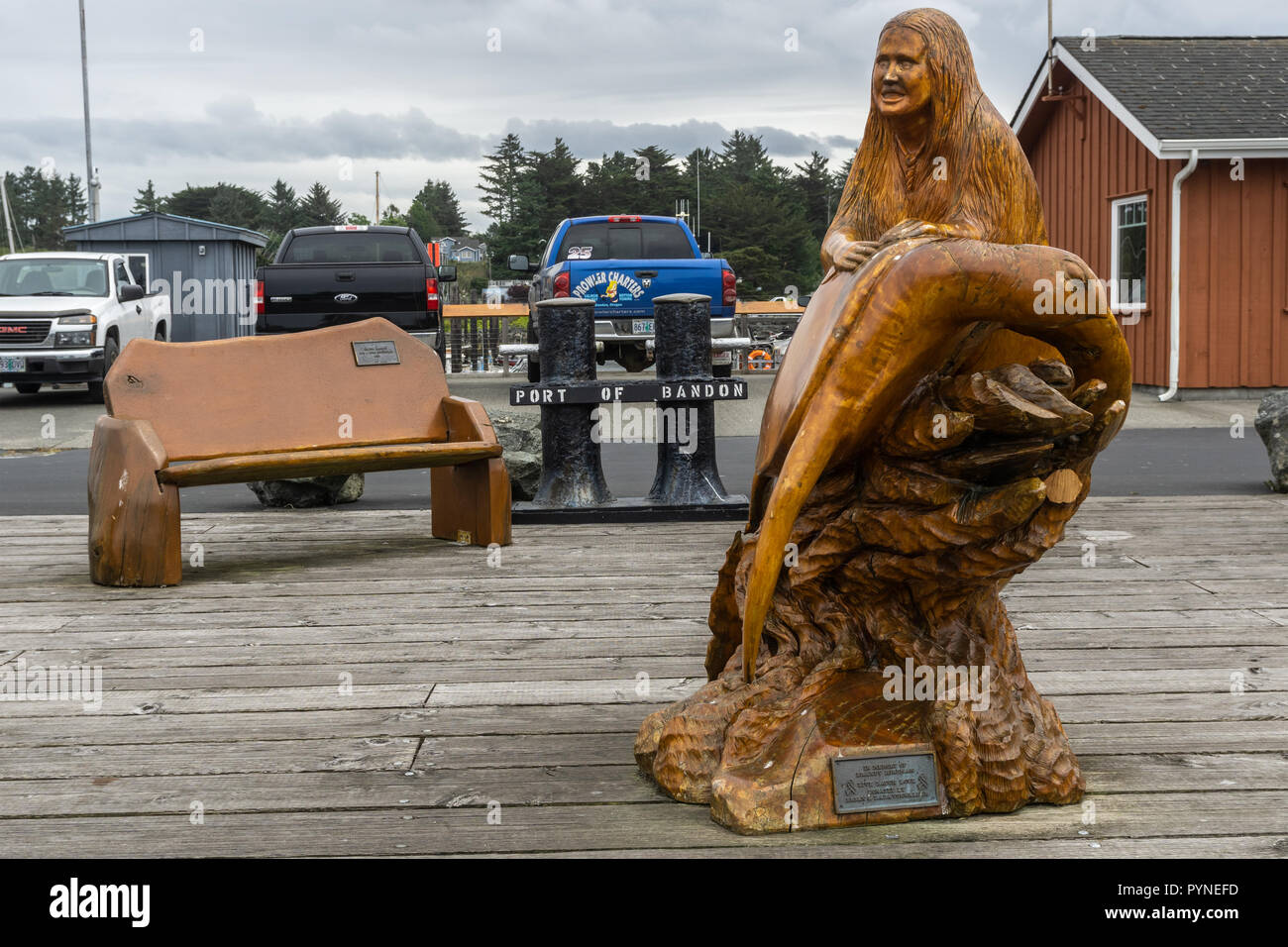Port of old Bandon dock with wooden artworks, Oregon, USA. Stock Photo