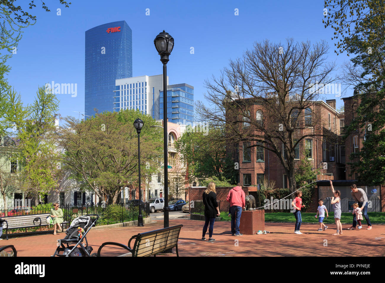Fitlers Square Neighborhood park in Spring with kids playing jump rope, Philadelphia, Pennsylvania, USA Stock Photo