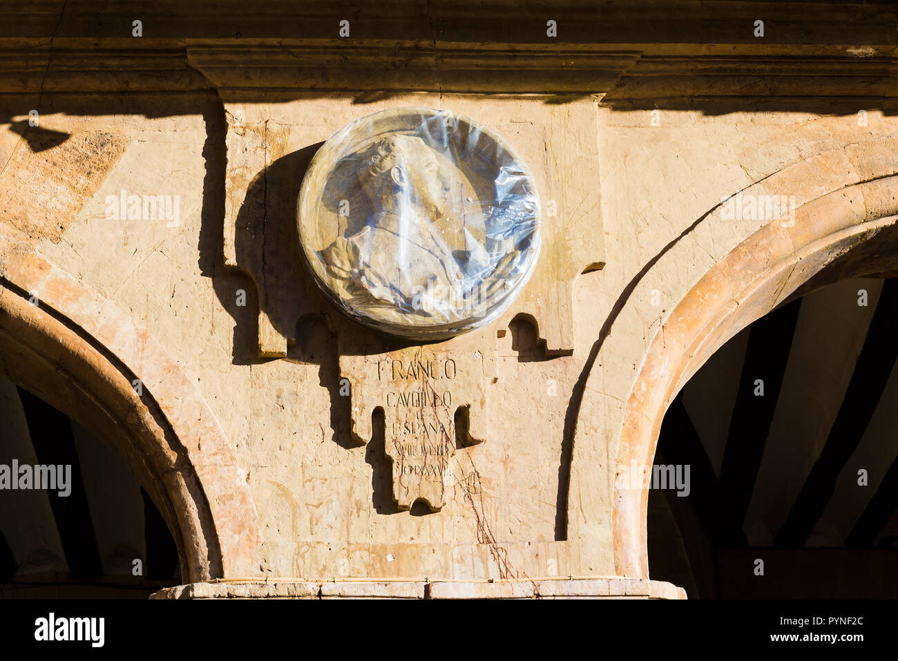 Medallion dedicated to Francisco Franco, spanish dictator, protected with plastic to avoid the eggs that stain him. Removed on June 9, 2017. The Plaza Stock Photo