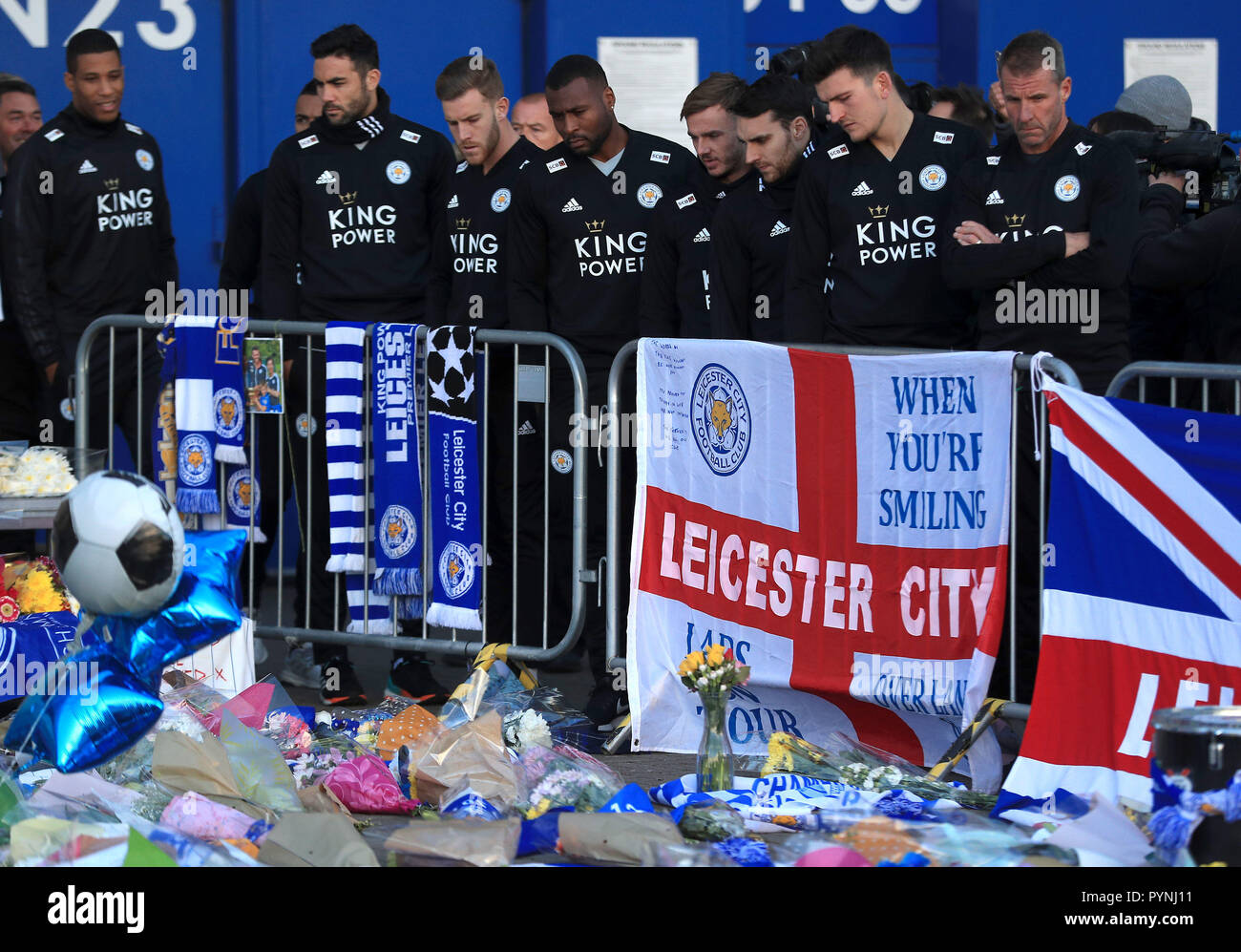Leicester players pay respects to club chairman Vichai Srivaddhanaprabha, who was among those to have tragically lost their lives on Saturday evening when a helicopter carrying him and four other people crashed outside King Power Stadium. Stock Photo