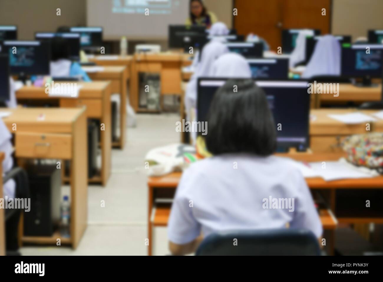 focus blur, the student with teacher learning business technology desktop computer in a classroom Stock Photo