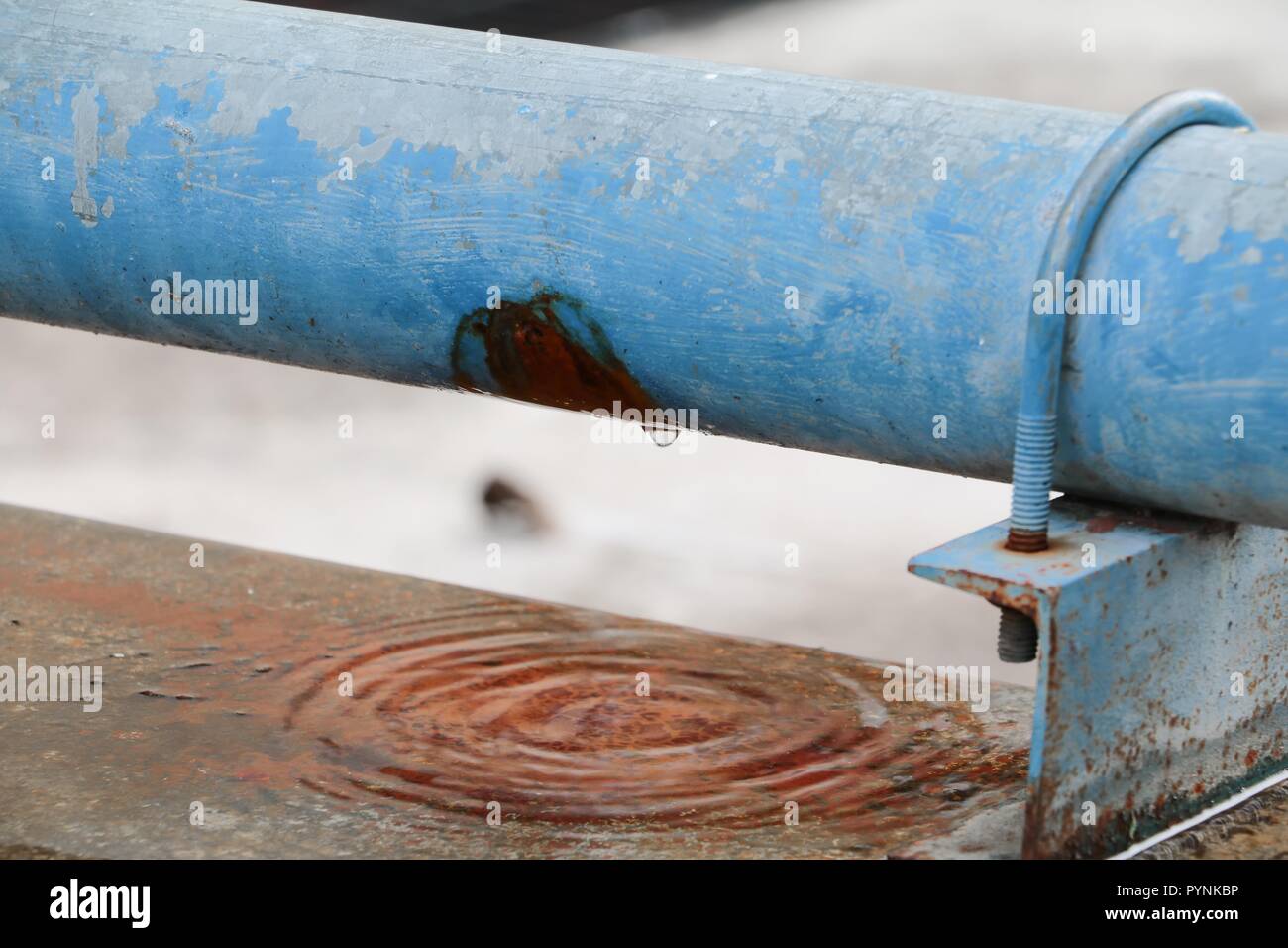 plumbing main tube and water leak, old tap pipe steel rust Stock Photo