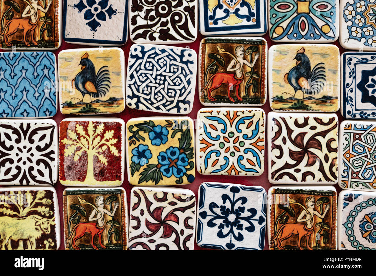 Colorful ceramic fridge magnets for sale in Erice, Sicily, southern Italy. Stock Photo