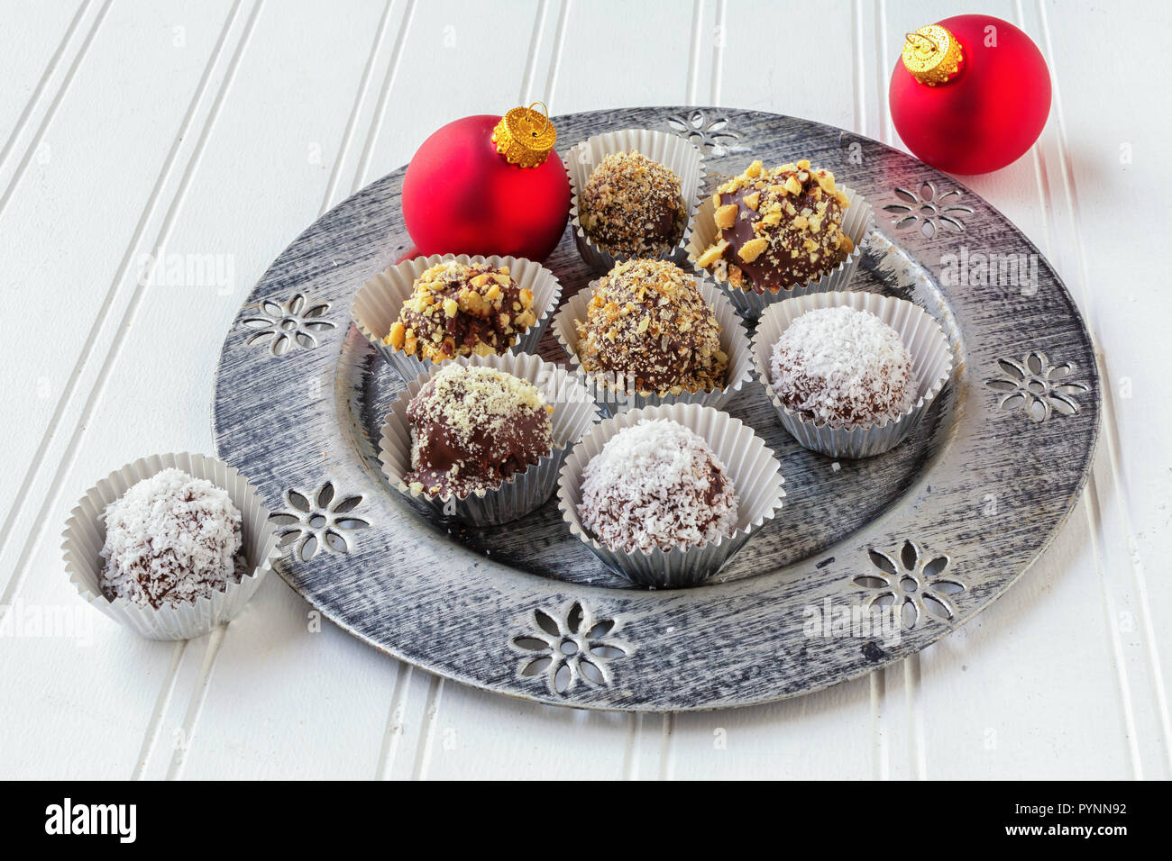 Homemade chocolate truffles each in its own foil cup. A Christmas favourite. Stock Photo