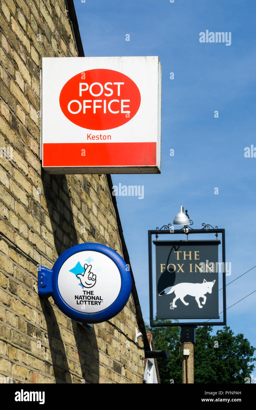 Signs for the Post Office, National Lottery and pub in the village of Keston, Kent. Stock Photo