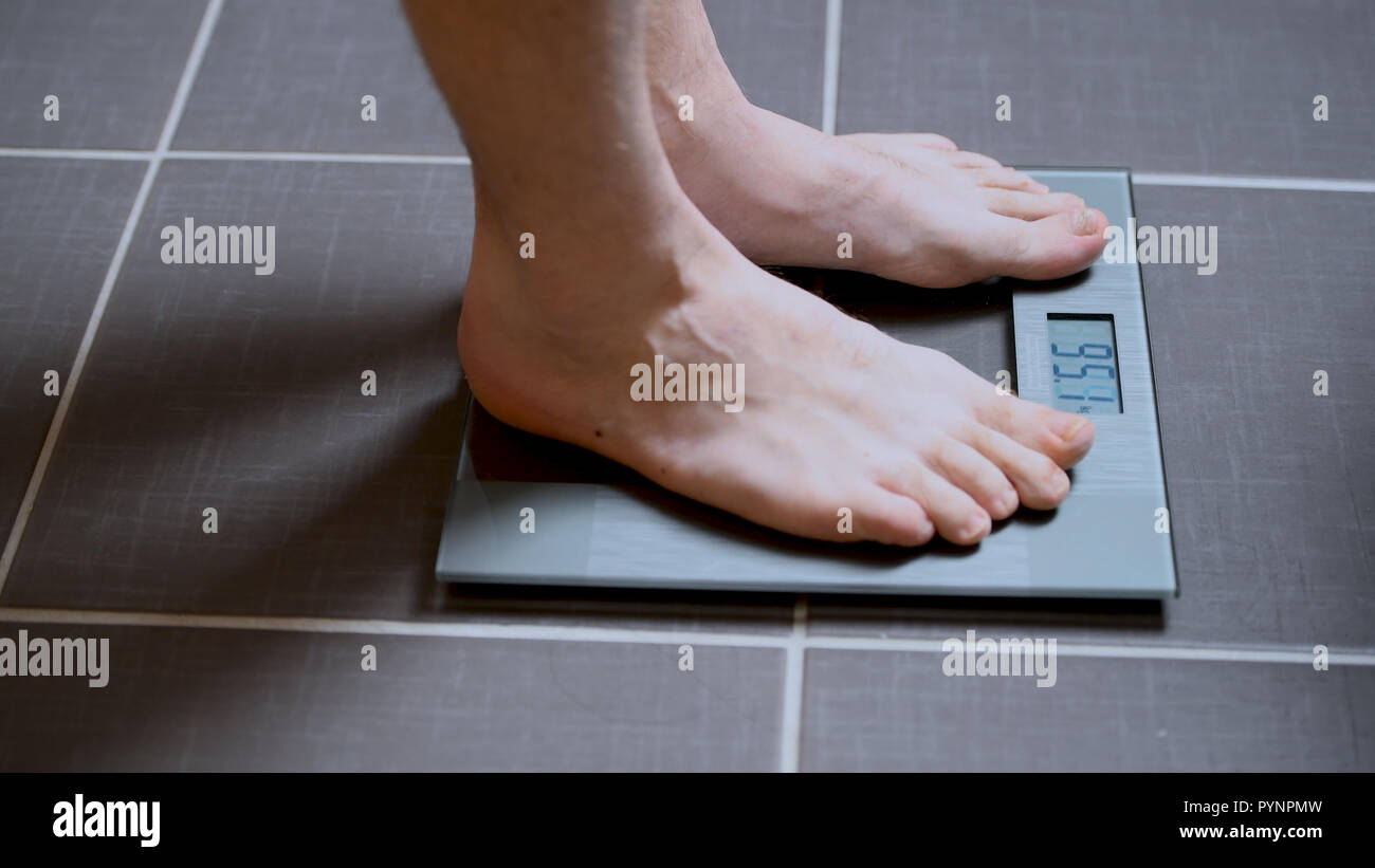 Male Feet On Glscales Menst Body Weight Close Up Man Standing On Scale Male Feet On Glscales Menst Body Weight Close Up Man Standing On Scale