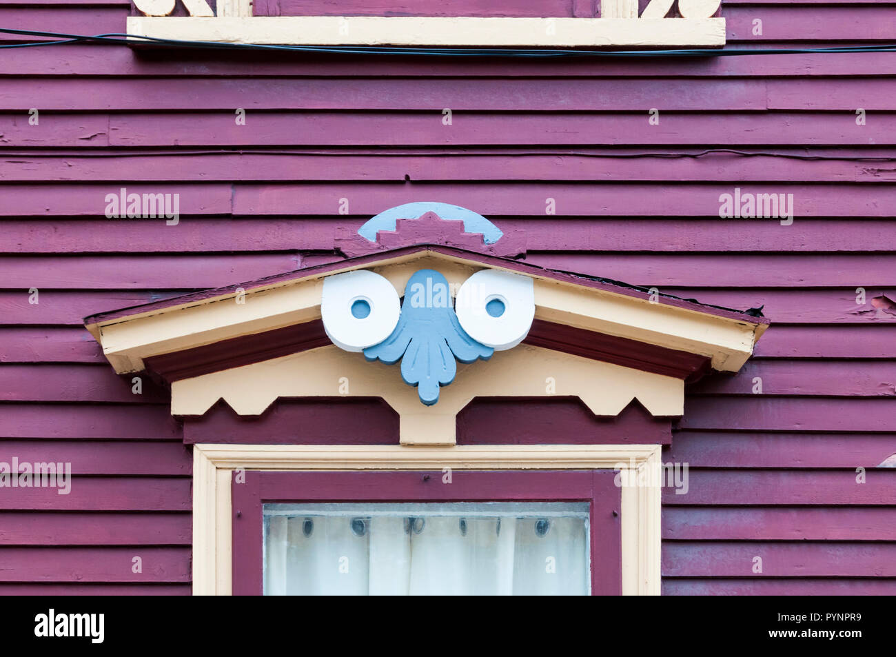 A carved wooden porch over a doorway on one of the colourful houses on Gower Street in St John's, Newfoundland. Stock Photo