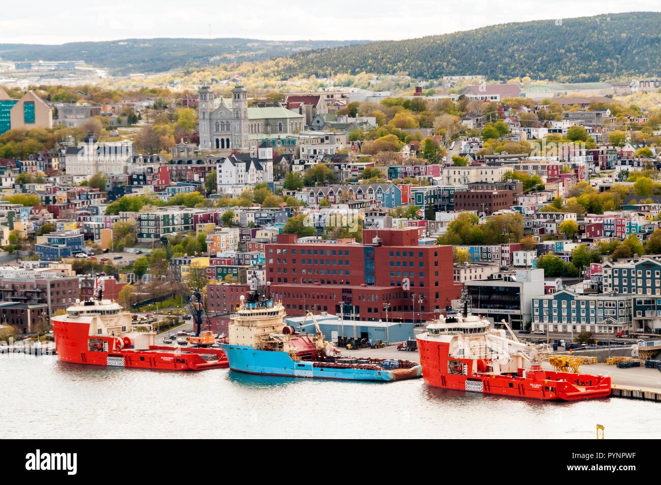 Offshore supply ships & tugs moored along the waterfront at St John's