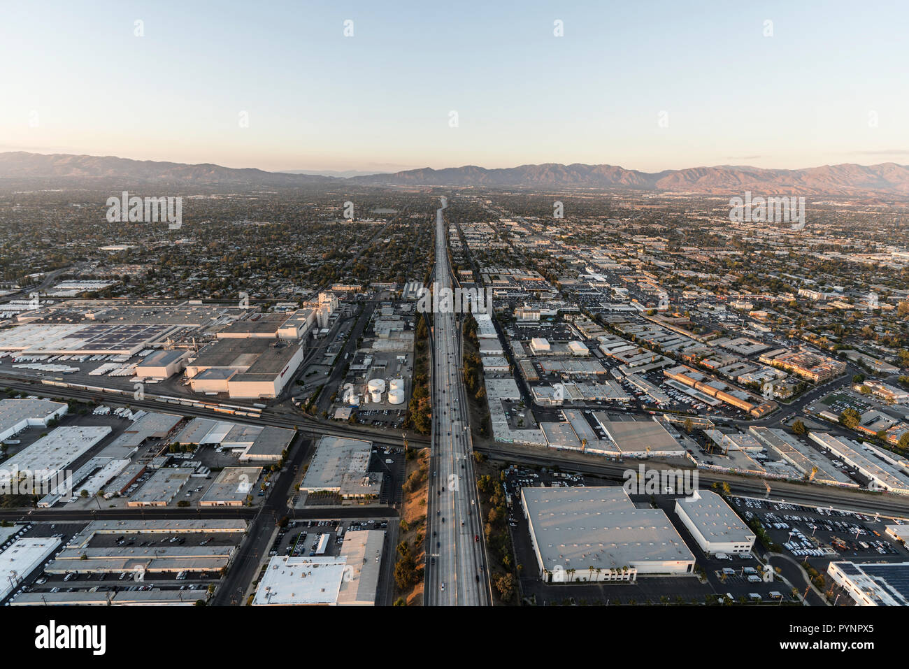 Los Angeles, California, USA - October 21, 2018:  Aerial view industrial buildings and the 405 freeway near Roscoe Blvd in the San Fernando Valley are Stock Photo