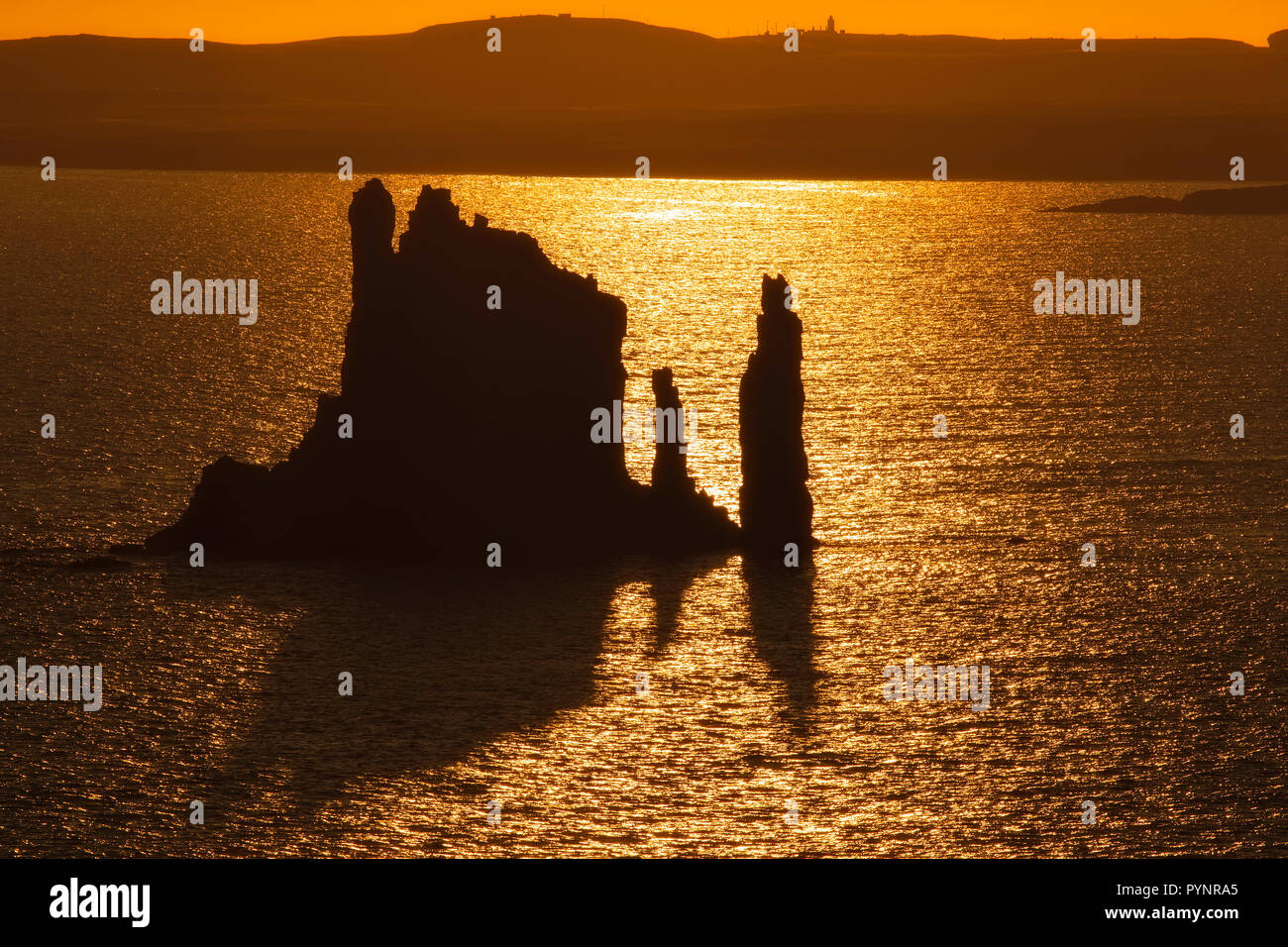 The Drongs sea stacks and sunset, Hillswick, Northmavine, Shetland Stock Photo