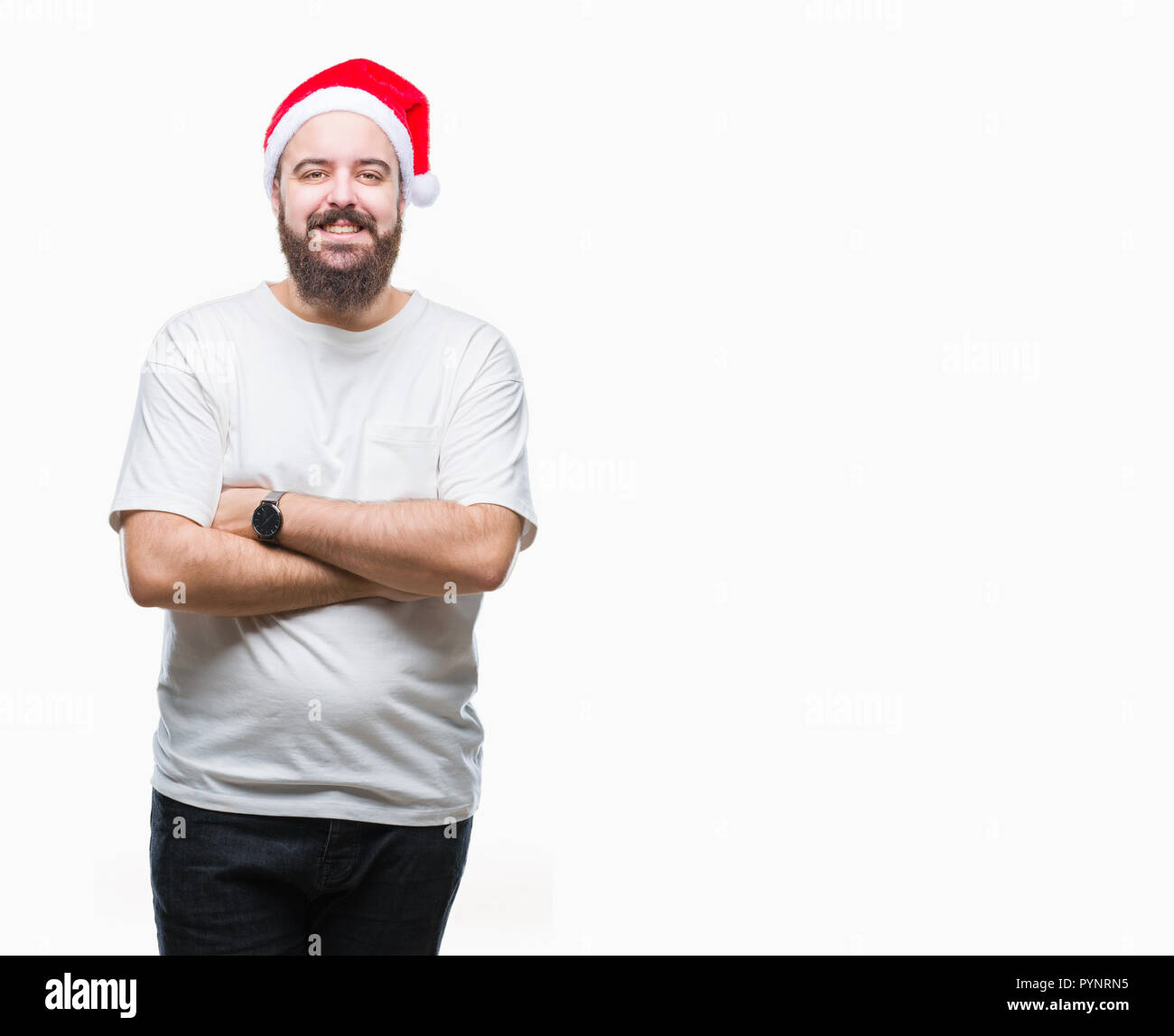 Young caucasian hipster man wearing christmas hat over isolated background happy face smiling with crossed arms looking at the camera. Positive person Stock Photo