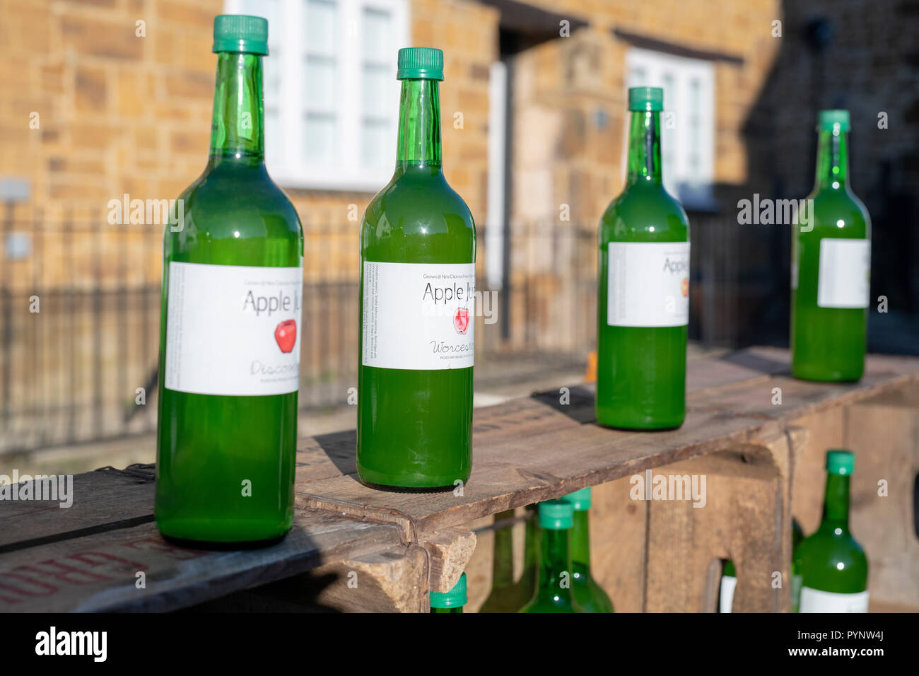 Apple juice bottles on a stall at Deddington farmers market. Deddington
