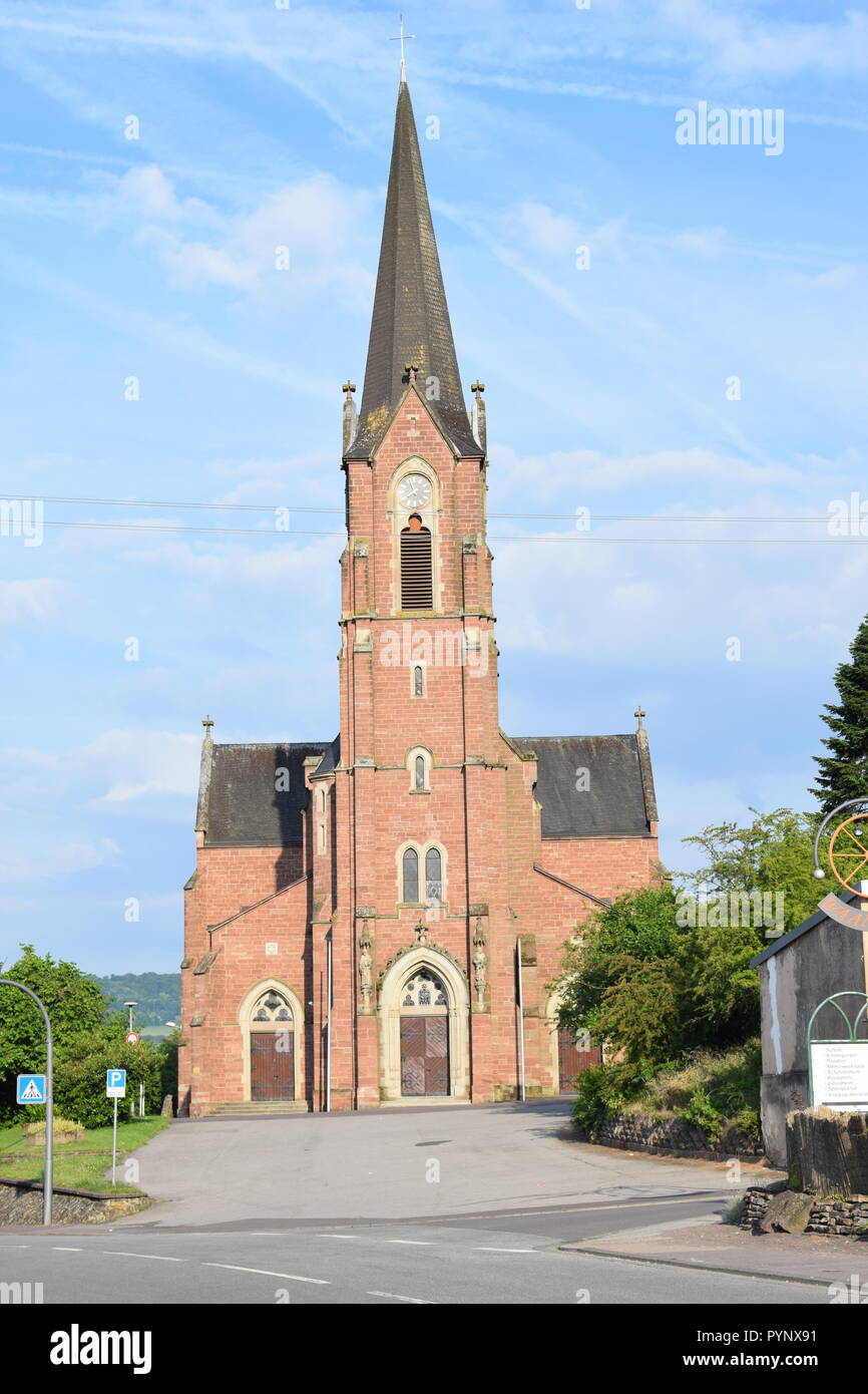 The Catholic Church St. Andreas built from 1898/1901, in Reimsbach view from the frontage, blue sky and sunny weather, Ansicht von vorne. Stock Photo