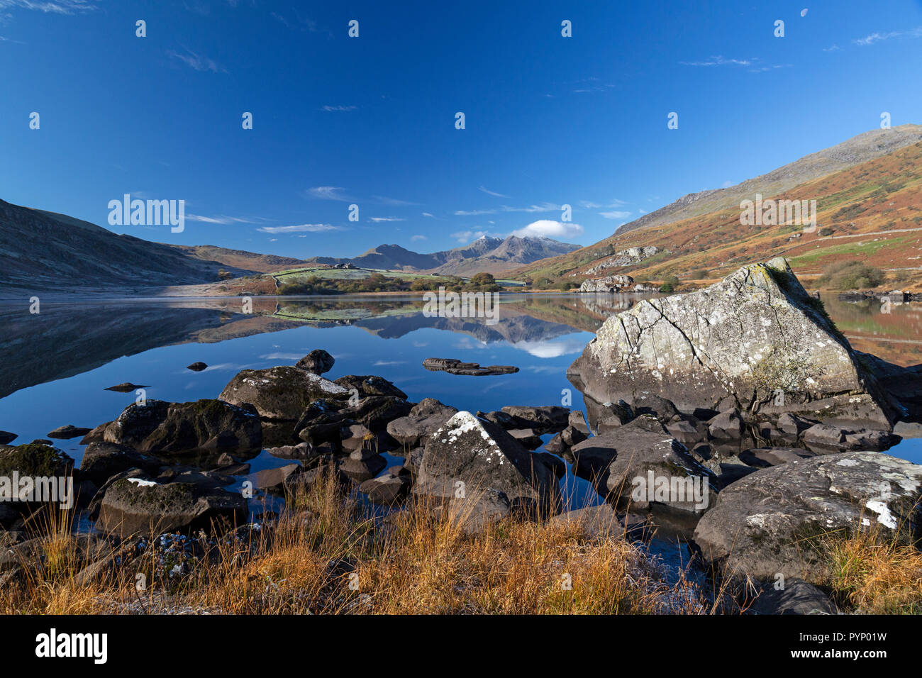 Early morning winter view, looking west across Llynnau Mymbyr near Capel Curig towards Mount Snowdon in the Snowdonia National Park in North Wales. Stock Photo