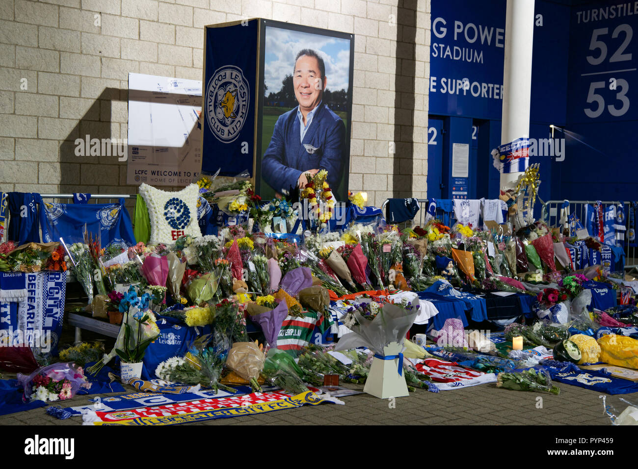 Leicester, UK. 29th Oct, 2018. Fans lay flowers at the illuminated Leicester City Football ground after the owner was killed in his helicopter. Credit: robin palmer/Alamy Live News Stock Photo