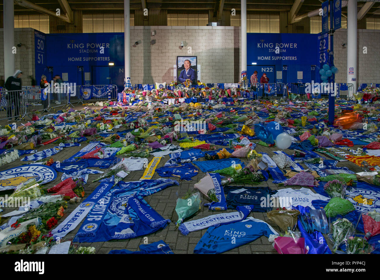 Leicester, UK. 29th Oct, 2018. Flowers and tributes illuminated at the King Power Leicester City Football ground after the owner Vichai Srivaddhanaprabha was killed in his helicopter on Saturday. Credit: robin palmer/Alamy Live News Stock Photo
