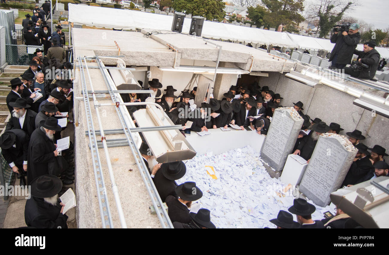 NEW YORK, NY - NOVEMBER 25: Chabad-Lubavitch rabbis pray at the gravesite of the lubavitcher Rebbe, Rabbi Menachem M. Scheerson, 4,550 rabbis from around the world are in New York for the International Conference of Chabad-Lubavitch Emissaries, an annual event aimed at reviving Jewish awareness and practice around the world. This year marks the 75th year since Rabbi Menachem M. Schneerson, of blessed memory, the movements leader, arrived on U.S. shores from war-torn Europe in 1941 on November 25, 2016 in Queens borough of New York  People:  Chabad-Lubavitch Rabbis Stock Photo