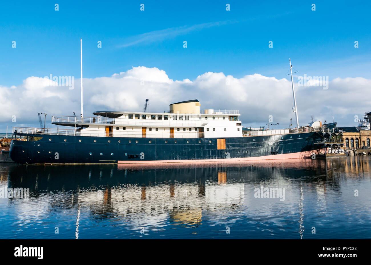 Leith docks, Edinburgh, Scotland, United Kingdom. 30th Oct, 2018. UK Weather: Sunshine on Leith this morning creates colourful reflections in the Water of Leith river. MV Fingal ship continues its refit and repainting in the dock from a former lighthouse tender to a luxury floating hotel due to open in January 2019 Stock Photo