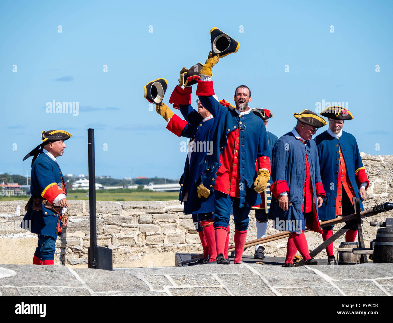 Men in eighteenth century Spanish period costume at Castillo de San Marcos in St Augustine Florida USA after firing a cannon from the battlements Stock Photo