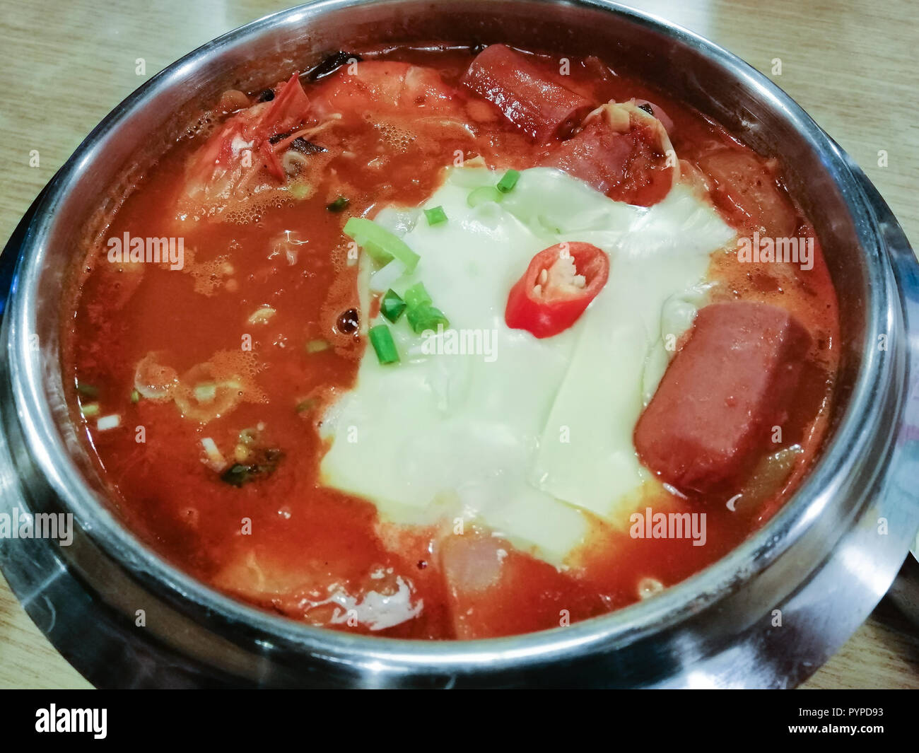 Delicious Korean food Yukgaejang spicy seafood soup with cheese