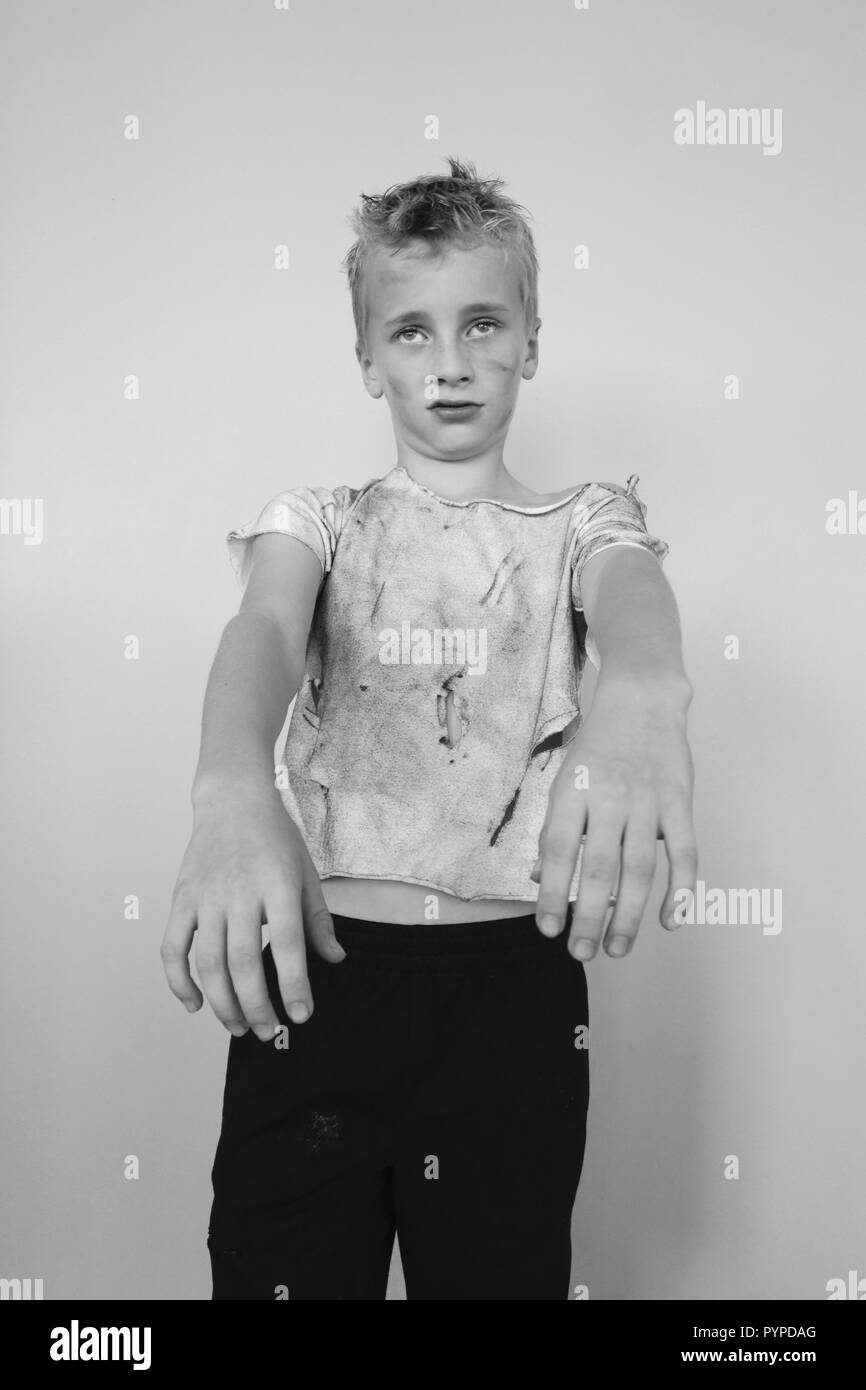 Black and white portrait of a young boy in his Halloween zombie costume Stock Photo