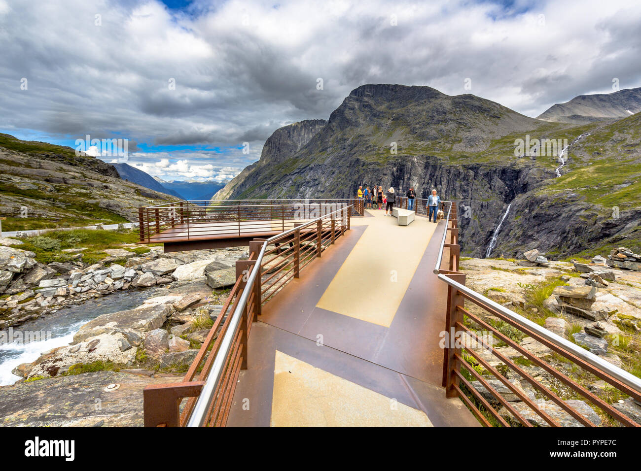 Tourists on observation platform at Trollstigen road tourist attraction in More og Romsdal region Norway Stock Photo