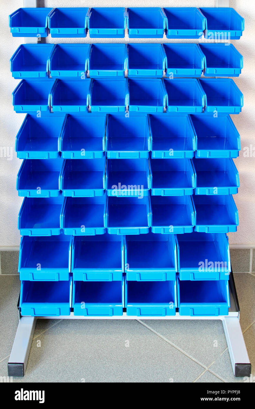 Blue plastic open box organizer in storehouse Stock Photo Alamy