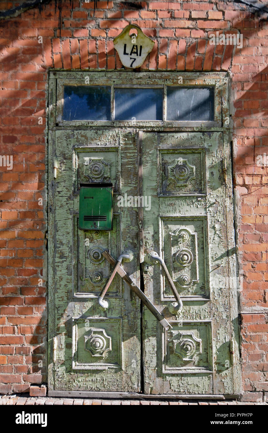 Rusty door in a home of Tartu Old Town, Estonia Stock Photo
