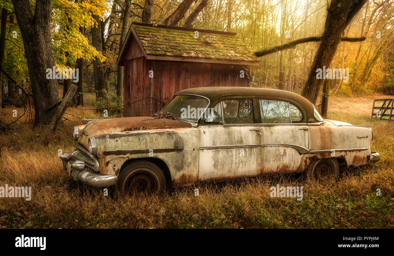 1954 Dodge sitting in driveway in autumn scene Stock Photo