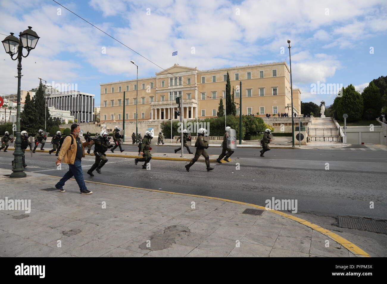 Athens, Greece. 29th Oct, 2018. Greek riot policemen clash with hooded people in Syntagma Square. Small skirmishes in Syntagma Square, followed a big student demonstration in Athens where students said no to further Austerity measures. Credit: George Panagakis/Pacific Press/Alamy Live News Stock Photo