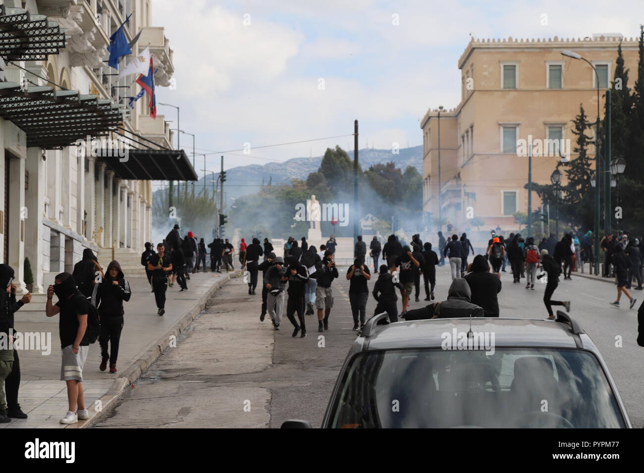 Athens, Greece. 29th Oct, 2018. Greek riot poliver clash with hooded people in Syntagma. Small skirmishes n Syntagma Square, followed a big student demonstration in Athens where students said no to further Austerity measures. Credit: George Panagakis/Pacific Press/Alamy Live News Stock Photo