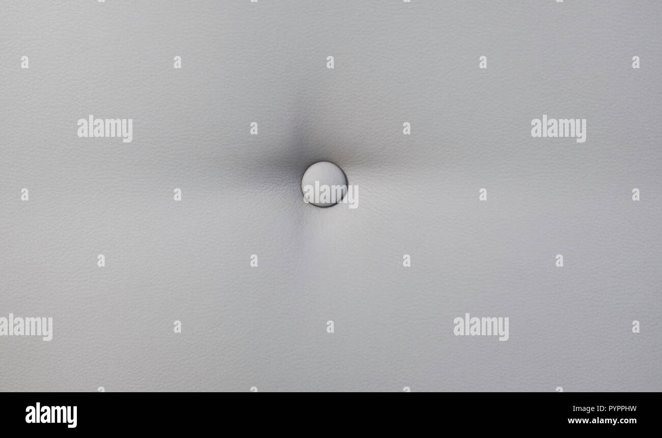 Creamy leather sofa background with buttons as a texture. Stock Photo