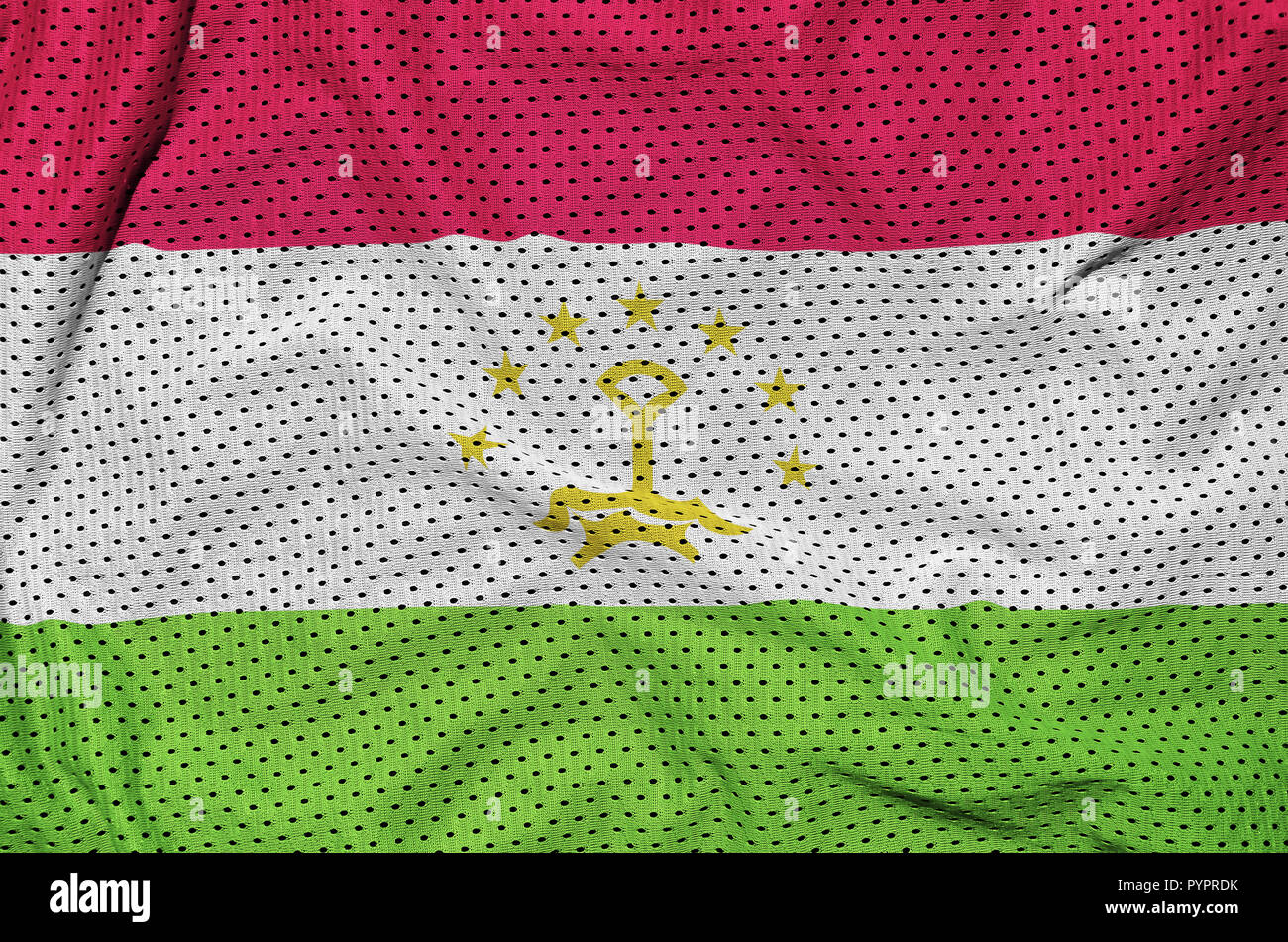 Tajikistan flag printed on a polyester nylon sportswear mesh fabric with some folds Stock Photo