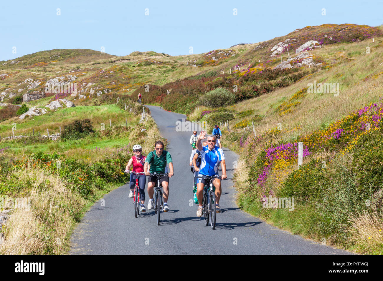 Unidentified cyclists riding along the Sky Road, near Clifden in County Galway, Ireland. Stock Photo